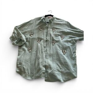 Women's sage green embellished crystal blouse.